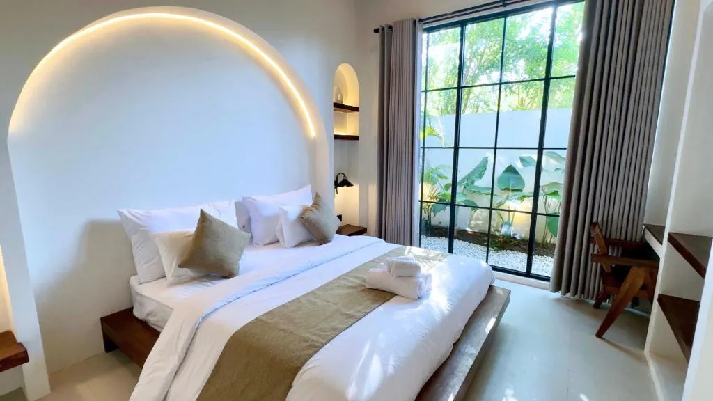 Malasama bedroom with garden view